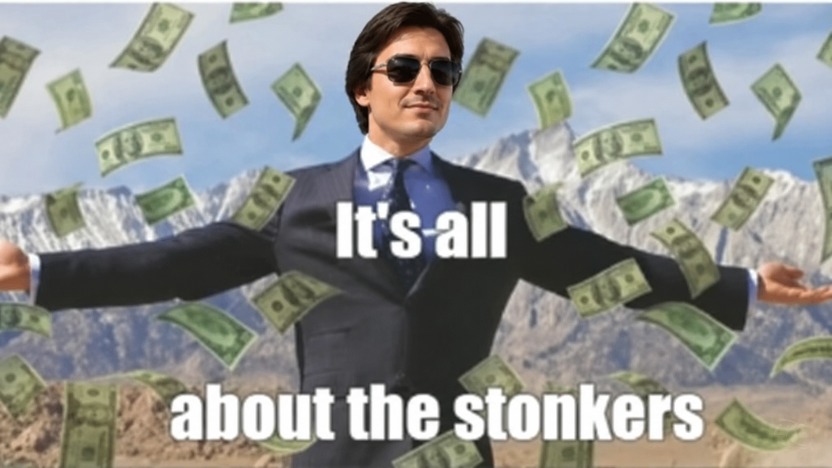Suited man in sunglasses with arms outstretched as money rains down, captioned It's all about the stonkers